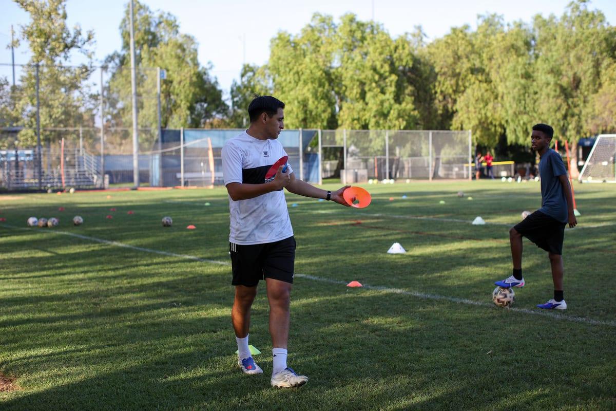 An AFC coach running a Performance training session in Orange County