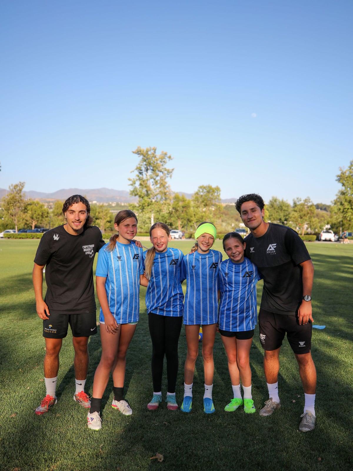 AFC coaches and young athletes together after a training session in Lake Forest